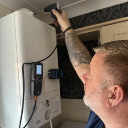 Gas Safe engineer servicing a domestic gas boiler