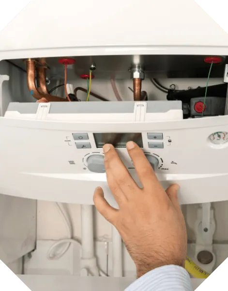 Engineer servicing the heating system in a static caravan