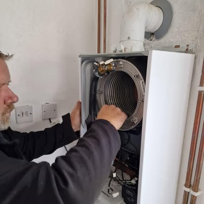 Gas Safe registered engineer checking a gas appliance