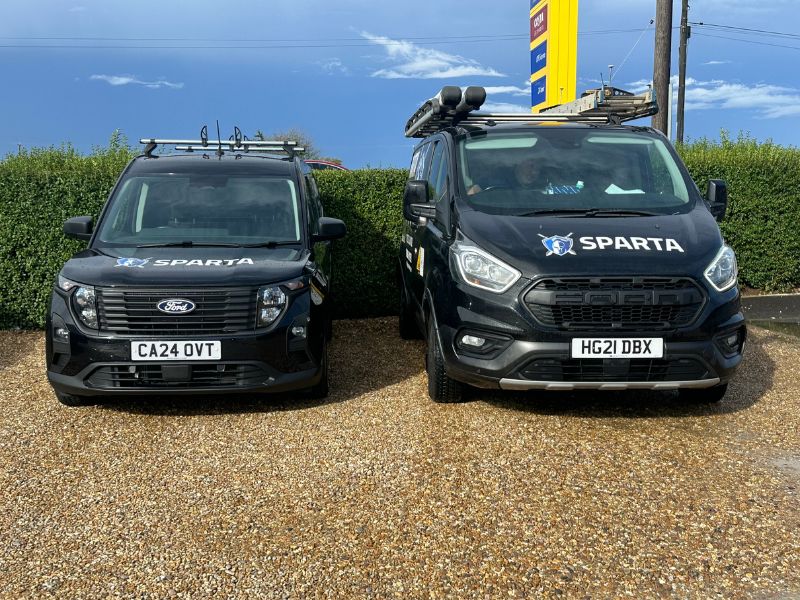 Two liveried Sparta Heating vans parked side by side in Lincolnshire